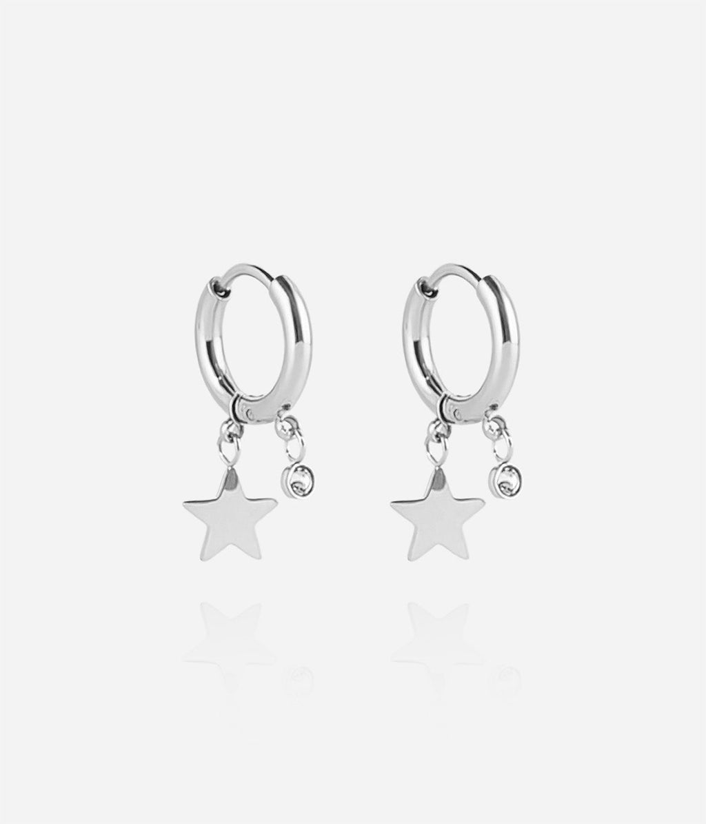 Boucles d'oreilles Lucky Star Zag créole acier avec pampille étoile et cristal blanc au lobe.