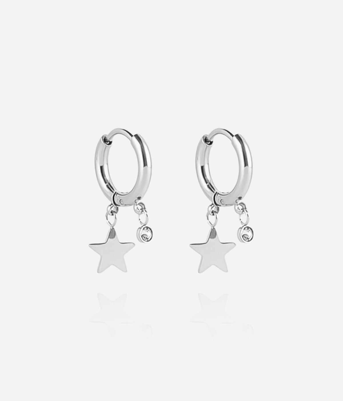 Boucles d'oreilles Lucky Star Zag créole acier avec pampille étoile et cristal blanc au lobe.