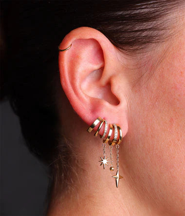 boucles d'oreilles Zag étoiles filantes", "créoles double étoile zirconium", "multi-créoles anneau serti