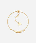 Bracelet Pythagore Zag, chaînette en acier doré ornée de petits cubes