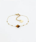 Bracelet Velasquez ZAG – Œil de tigre et chaîne chapelet dorée, vue porté au poignet. Les Tendances de Charlotte, Saint-Quentin.